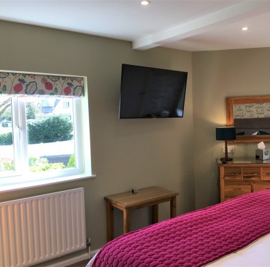 Luxury bedroom furniture at boutique Windermere hotel The Hideaway